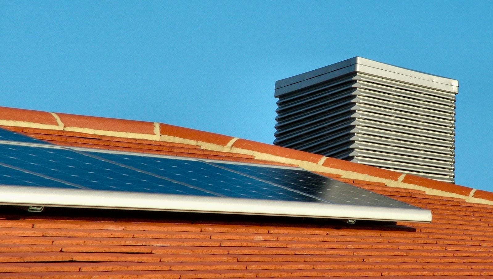 Close-up of solar panels on a terracotta roof